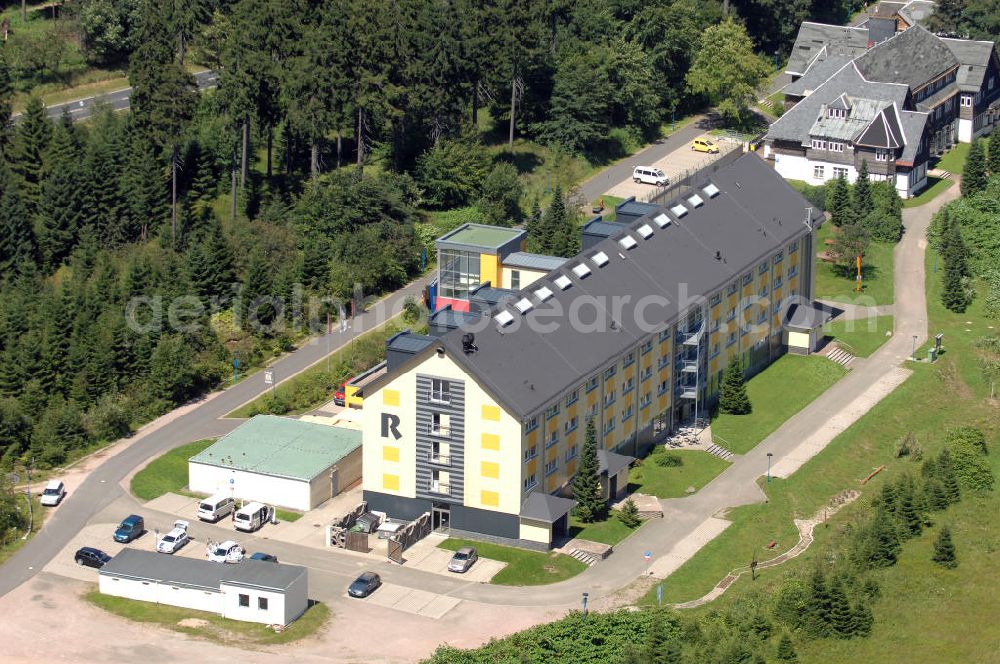 Aerial photograph Oberhof - Blick auf das Ferienzentrum Oberhof / Rennsteig, ein Haus der AWO Sano Thüringen gGmbH. Das Haus besitzt 66 Zimmer sowie Tagungs- und Veranstaltungsräume. Es ist ca. 10 km von Oberhof entfernt und liegt am Waldrand des Rennsteiggebietes. Oberhof ist als deutsches Wintersportzentrum bekannt. Besonders populär sind hier die Sportarten Biathlon, Rennrodeln bzw. Bobsport, Skilanglauf und die Nordische Kombination. Die Stadt lebt vom Tourismus. Kontakt AWO SANO Ferienzentrum Oberhof / Rennsteig: info@awosano.de