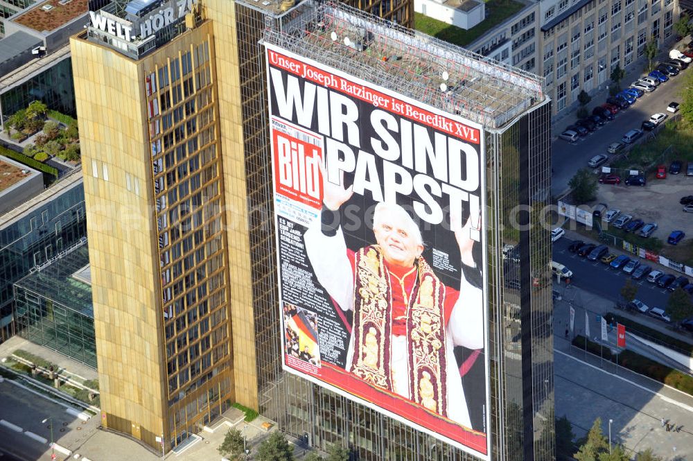 Berlin Kreuzberg from above - Verlagsgebäude Axel-Springer-Haus geschmückt mit der Tietelseite der Bildzeitung vom Tag nach der Wahl von Joseph Ratzinger zum Papst Benedikt XVI in Berlin-Kreuzberg. Publisher building Axel-Springer-Haus decorated with the cover of the newspaper Bild from the day after the election of Joseph Ratzinger to Pope Benedict XVI in Berlin-Kreuzberg.