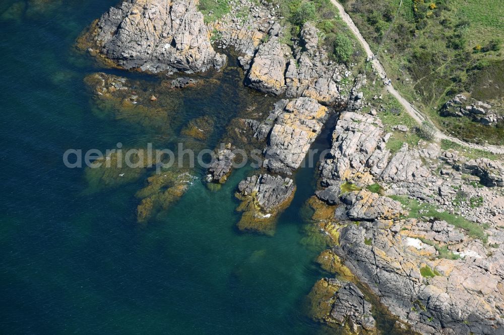 Allinge from the bird's eye view: Blue Water on Coastline at the rocky cliffs of Baltic Sea on Bornholm Island in Allinge in Region Hovedstaden, Denmark