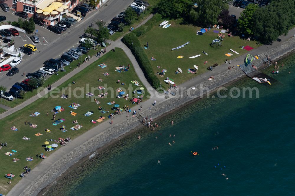 Meersburg from above - Bathers look to cool off in summer on the banks of the Lake Constance in Meersburg at Bodensee in the state Baden-Wuerttemberg, Germany