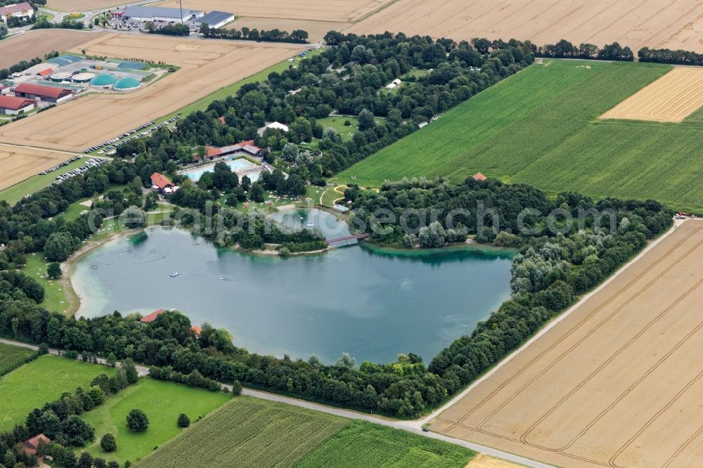 Mammendorf from above - Outdoor pool and amusement park Mammendorfer See near Fuerstenfeldbruck in the state of Bavaria, Germany. Mass influx of bathers on the beach and the shore area of a??a??the bathing lake and the sunbathing areas of the swimming pool with water slide