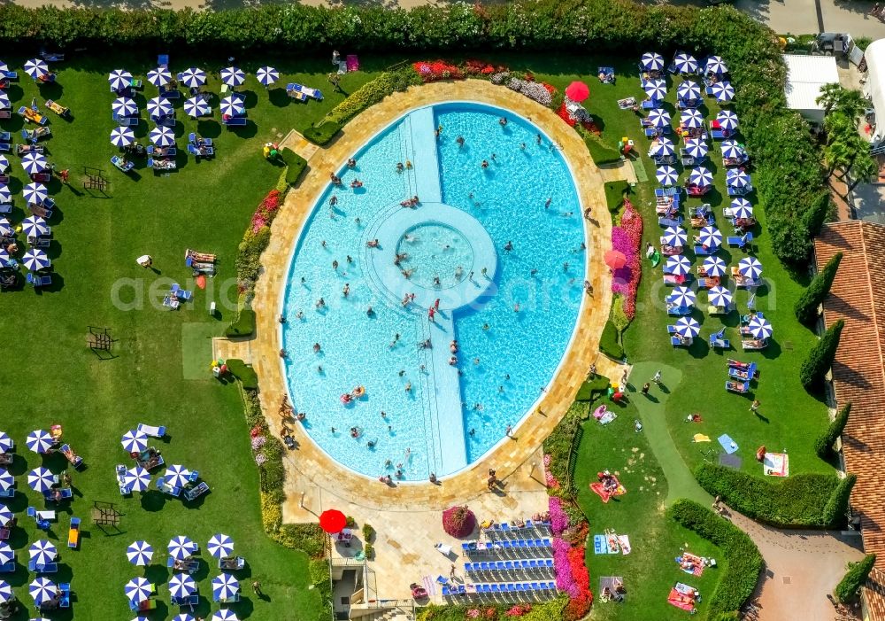 Aerial image Lazise - Bathers on the lawn by the pool of the campsite La Quercia in Lazise in Veneto, Italy