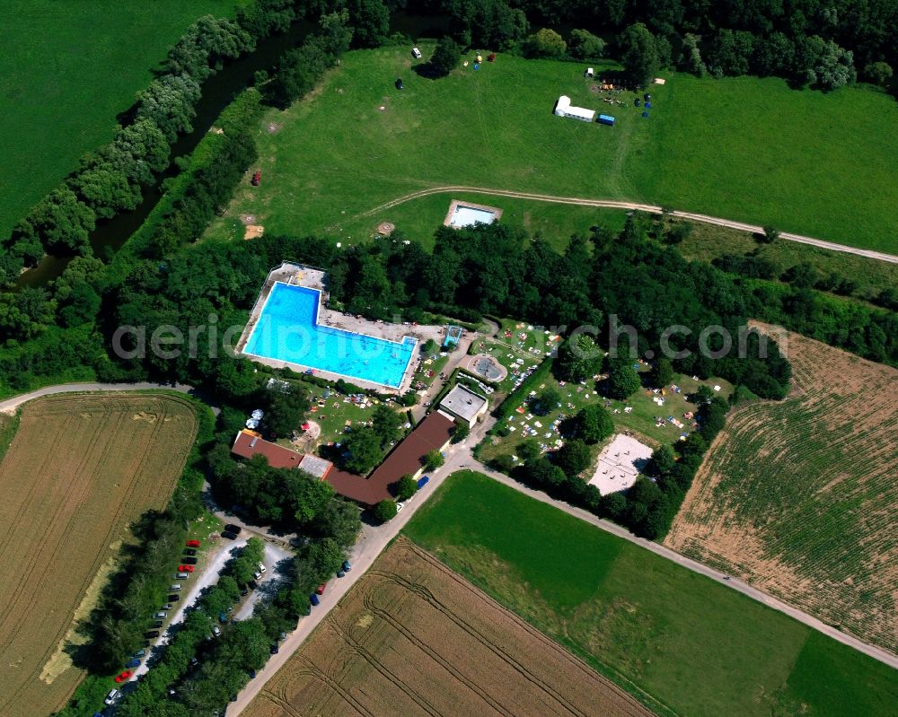 Aerial image Neudenau - Bathers on the lawn by the pool of the swimming pool in Neudenau in the state Baden-Wuerttemberg, Germany