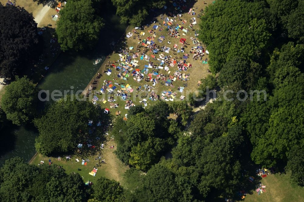 München from above - Bathers on the lawns on the shores of Middle Isar Canal in Munich in Bavaria