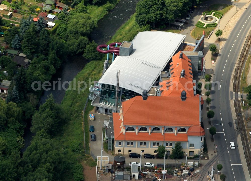 Aerial photograph Nordhausen - The bathhouse, a swimming pool with various spa services located in Nordhausen in Thuringia in the Grimmelallee. In the historical construction are a sports pool, a family pool and a health spa. In the background the tram depot in the Grimmelallee be seen