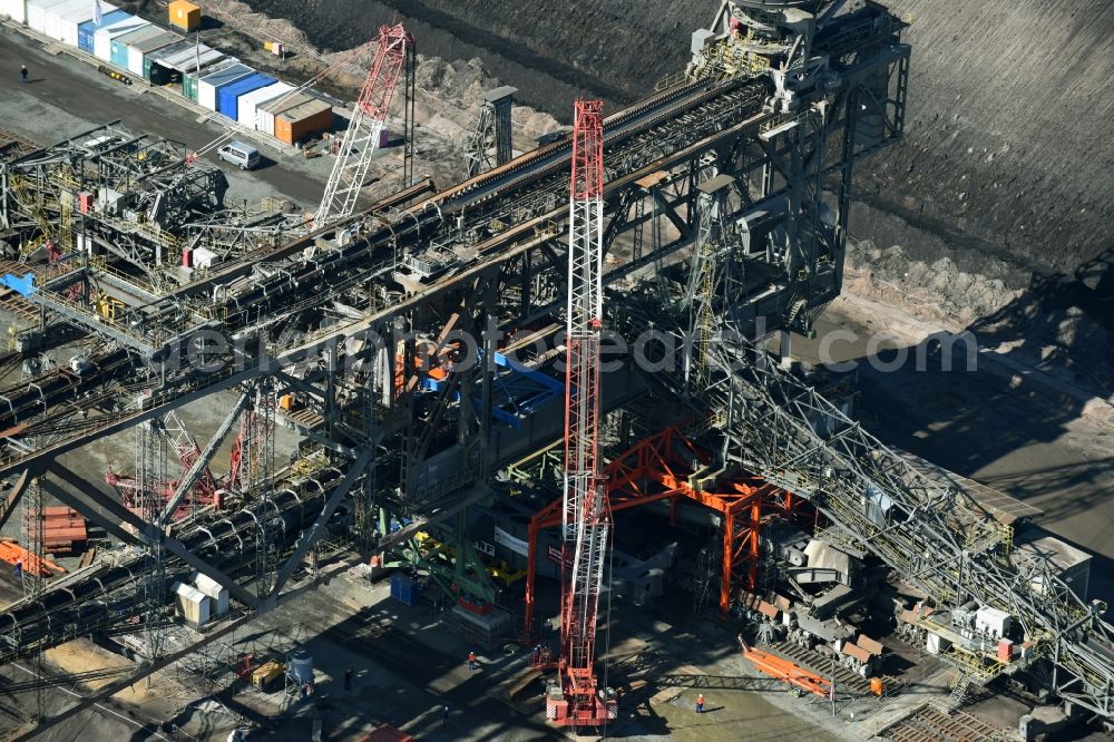 Nochten from above - Dredging conveyor bridge in brown coal mine der Vattenfall Europe Sales GmbH in Nochten in the state Saxony. The company TAKRAF GmbH - Tenova exchanged at Greater excavator with a roller table of the great rocker of the 40-year-old excavator