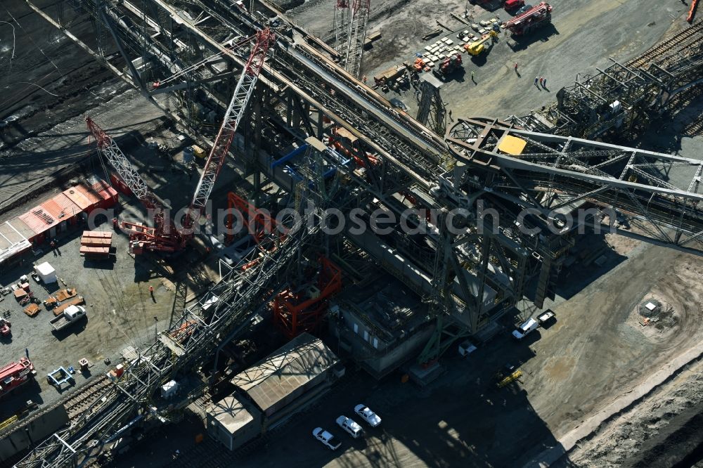 Aerial photograph Nochten - Dredging conveyor bridge in brown coal mine der Vattenfall Europe Sales GmbH in Nochten in the state Saxony. The company TAKRAF GmbH - Tenova exchanged at Greater excavator with a roller table of the great rocker of the 40-year-old excavator