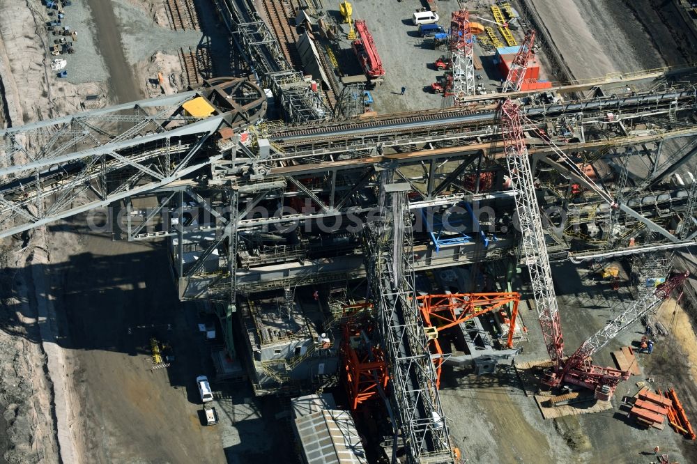 Nochten from above - Dredging conveyor bridge in brown coal mine der Vattenfall Europe Sales GmbH in Nochten in the state Saxony. The company TAKRAF GmbH - Tenova exchanged at Greater excavator with a roller table of the great rocker of the 40-year-old excavator