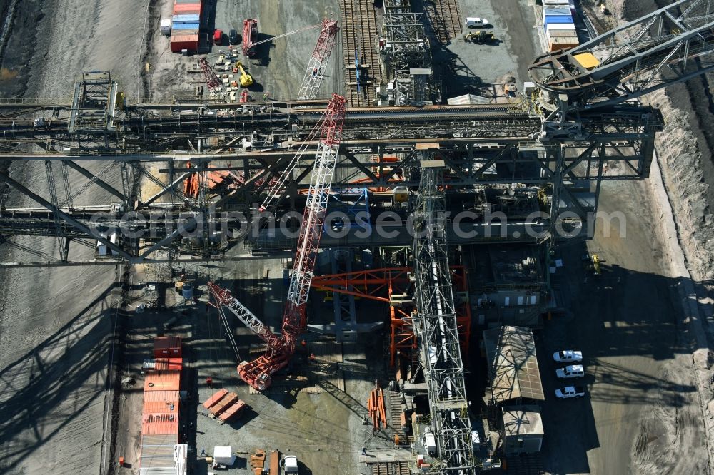 Aerial photograph Nochten - Dredging conveyor bridge in brown coal mine der Vattenfall Europe Sales GmbH in Nochten in the state Saxony. The company TAKRAF GmbH - Tenova exchanged at Greater excavator with a roller table of the great rocker of the 40-year-old excavator