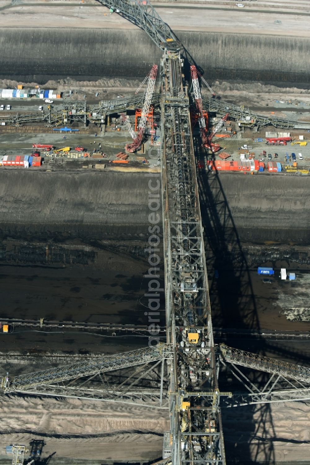 Aerial photograph Nochten - Dredging conveyor bridge in brown coal mine der Vattenfall Europe Sales GmbH in Nochten in the state Saxony. The company TAKRAF GmbH - Tenova exchanged at Greater excavator with a roller table of the great rocker of the 40-year-old excavator