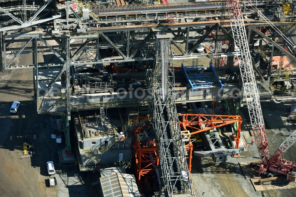 Aerial photograph Nochten - Dredging conveyor bridge in brown coal mine der Vattenfall Europe Sales GmbH in Nochten in the state Saxony. The company TAKRAF GmbH - Tenova exchanged at Greater excavator with a roller table of the great rocker of the 40-year-old excavator