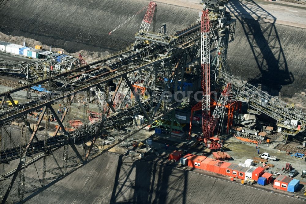 Nochten from above - Dredging conveyor bridge in brown coal mine der Vattenfall Europe Sales GmbH in Nochten in the state Saxony. The company TAKRAF GmbH - Tenova exchanged at Greater excavator with a roller table of the great rocker of the 40-year-old excavator