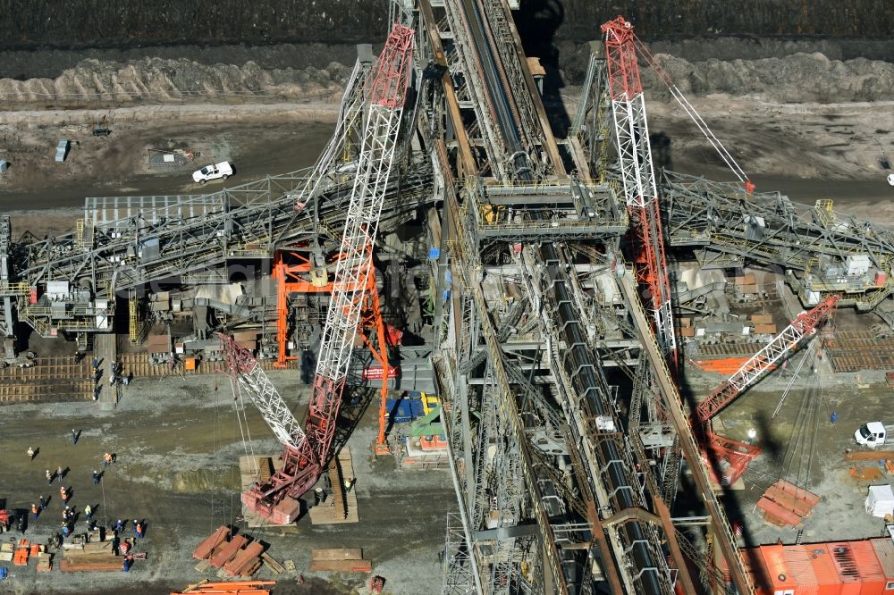 Aerial photograph Nochten - Dredging conveyor bridge in brown coal mine der Vattenfall Europe Sales GmbH in Nochten in the state Saxony. The company TAKRAF GmbH - Tenova exchanged at Greater excavator with a roller table of the great rocker of the 40-year-old excavator