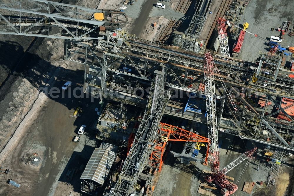 Aerial photograph Nochten - Dredging conveyor bridge in brown coal mine der Vattenfall Europe Sales GmbH in Nochten in the state Saxony. The company TAKRAF GmbH - Tenova exchanged at Greater excavator with a roller table of the great rocker of the 40-year-old excavator