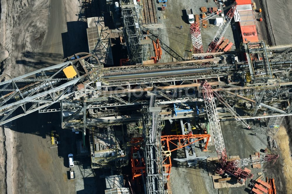 Nochten from above - Dredging conveyor bridge in brown coal mine der Vattenfall Europe Sales GmbH in Nochten in the state Saxony. The company TAKRAF GmbH - Tenova exchanged at Greater excavator with a roller table of the great rocker of the 40-year-old excavator