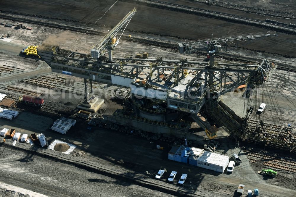 Nochten from above - Dredging conveyor bridge in brown coal mine der Vattenfall Europe Sales GmbH in Nochten in the state Saxony. The company TAKRAF GmbH - Tenova exchanged at Greater excavator with a roller table of the great rocker of the 40-year-old excavator