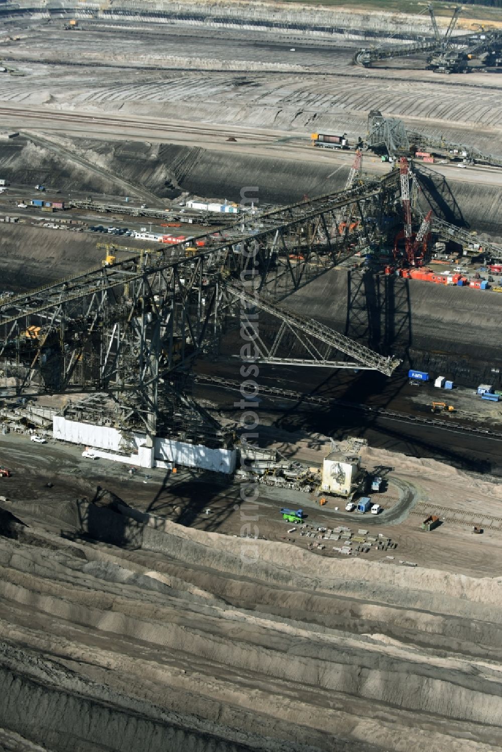 Nochten from above - Dredging conveyor bridge in brown coal mine der Vattenfall Europe Sales GmbH in Nochten in the state Saxony. The company TAKRAF GmbH - Tenova exchanged at Greater excavator with a roller table of the great rocker of the 40-year-old excavator