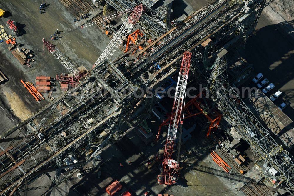 Nochten from above - Dredging conveyor bridge in brown coal mine der Vattenfall Europe Sales GmbH in Nochten in the state Saxony. The company TAKRAF GmbH - Tenova exchanged at Greater excavator with a roller table of the great rocker of the 40-year-old excavator