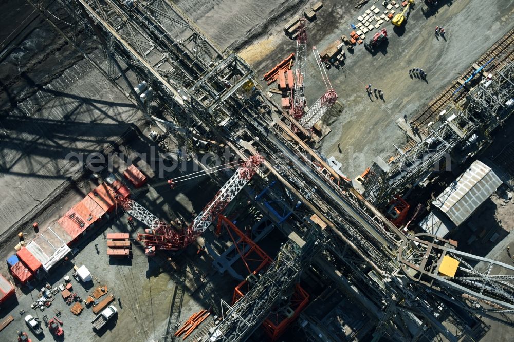 Nochten from the bird's eye view: Dredging conveyor bridge in brown coal mine der Vattenfall Europe Sales GmbH in Nochten in the state Saxony. The company TAKRAF GmbH - Tenova exchanged at Greater excavator with a roller table of the great rocker of the 40-year-old excavator