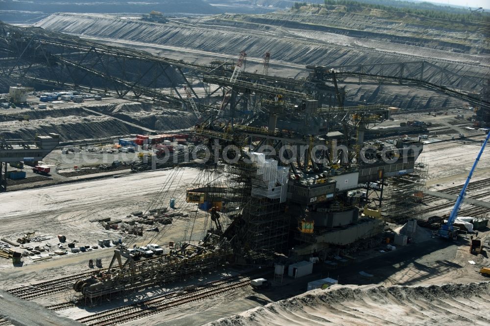 Aerial image Nochten - Dredging conveyor bridge in brown coal mine der Vattenfall Europe Sales GmbH in Nochten in the state Saxony. The company TAKRAF GmbH - Tenova exchanged at Greater excavator with a roller table of the great rocker of the 40-year-old excavator