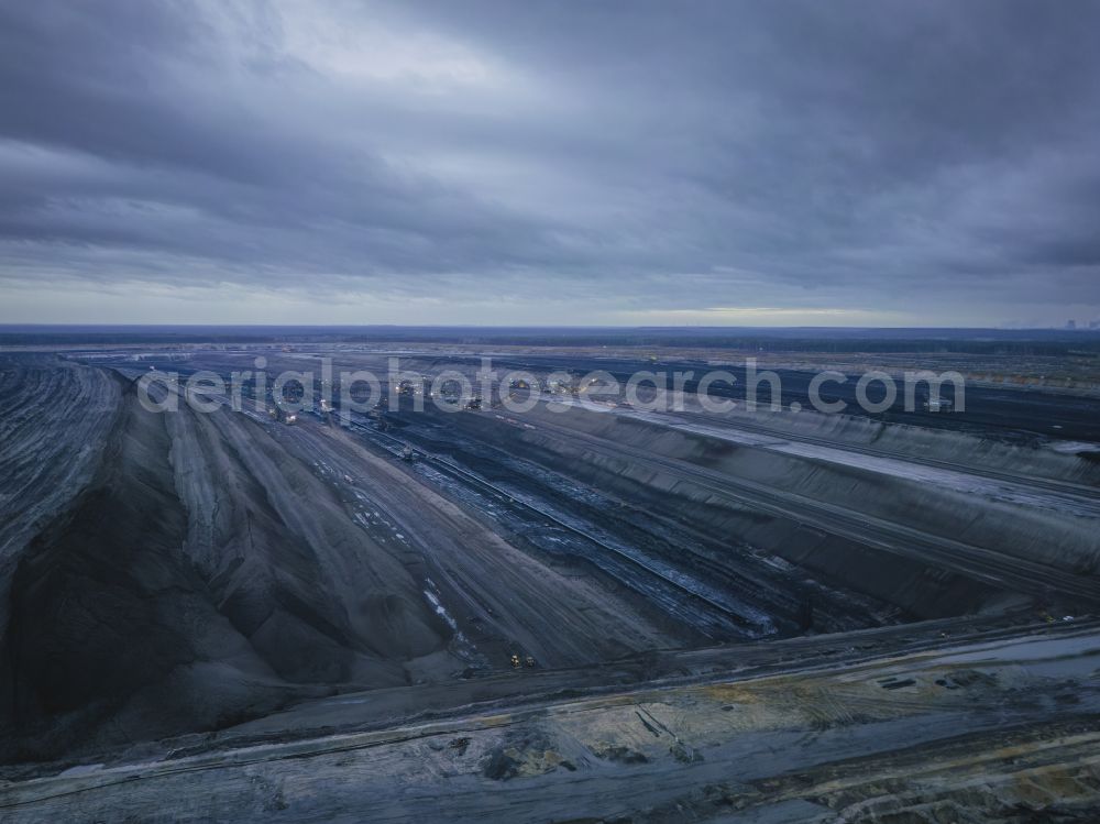 Aerial photograph Nochten - Excavator conveyor bridge in the seam of the mining area and the overburden areas in the lignite opencast mine of Vattenfall Europe Sales GmbH in Nochten in the federal state of Saxony