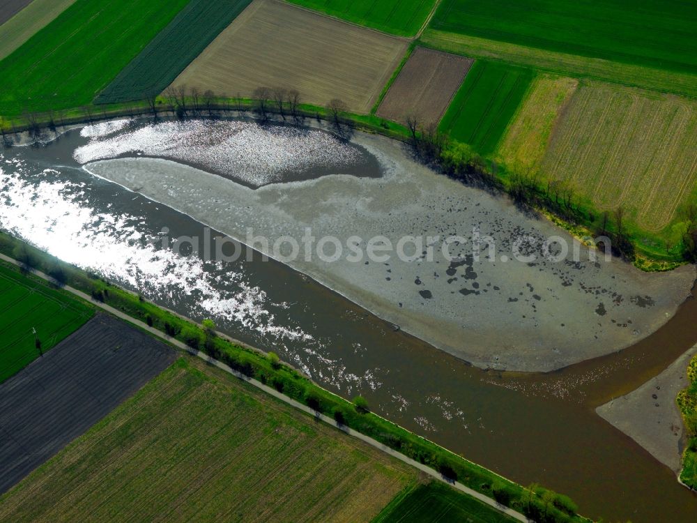 Aerial image Erbach - Quarry pond in Erbach an der Donau in the state of Baden-Wuerttemberg. The small lake, surrounded by agricultural fields, is located east of the town in an area consisting of several excavated lakes of varying sizes