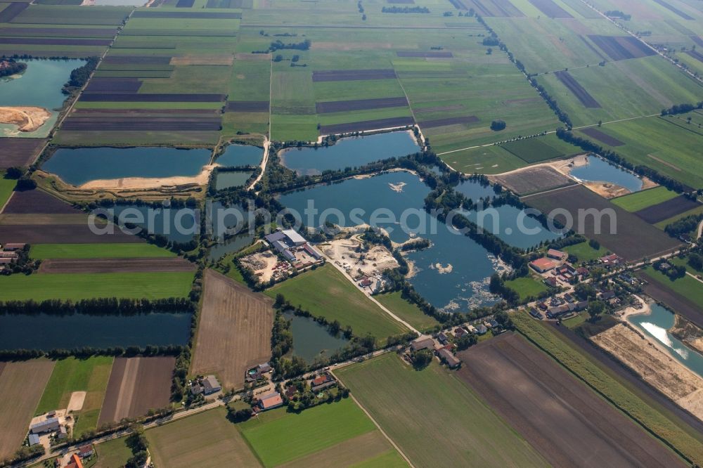 Rosing from the bird's eye view: Lake shore and overburden areas of the quarry lake and gravel open pit of Donaumoos Kies GmbH & Co. KG in Rosing in the state Bavaria, Germany