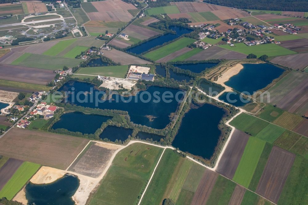 Aerial photograph Rosing - Lake shore and overburden areas of the quarry lake and gravel open pit of Donaumoos Kies GmbH & Co. KG in Rosing in the state Bavaria, Germany