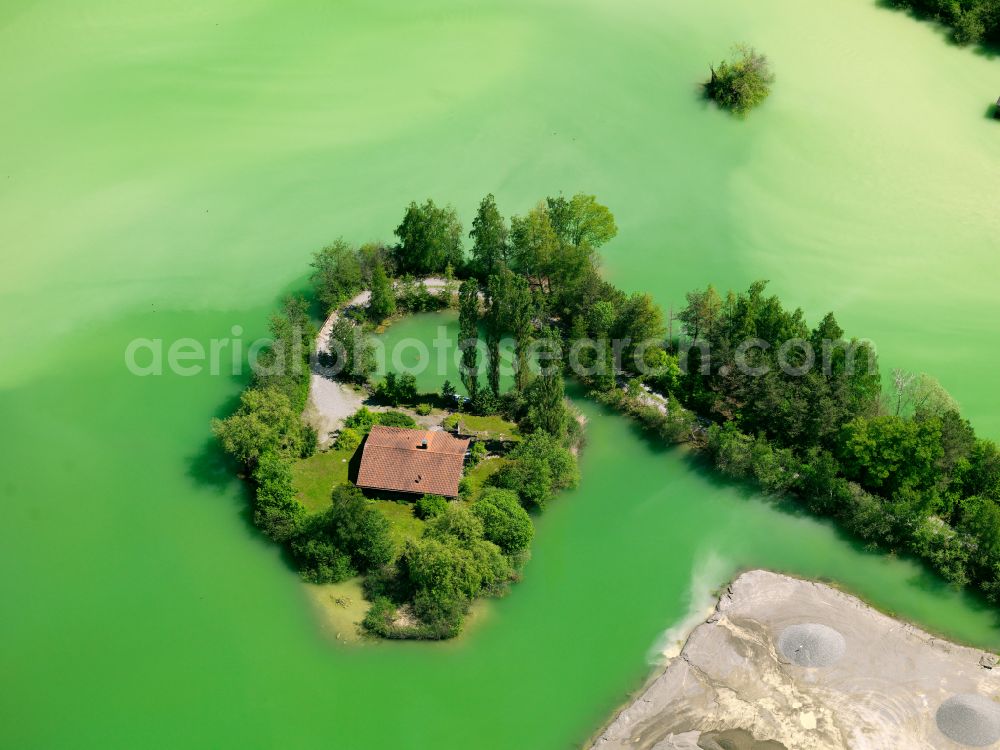 Schemmerhofen from above - Lake shore and overburden areas of the quarry lake and gravel open pit with a hut on street Ferdinand-Duenkel-Strasse in the district Alberweiler in Schemmerhofen in the state Baden-Wuerttemberg, Germany