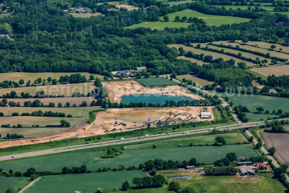 Selk from above - Lake shore and overburden areas of the quarry lake and gravel open pit oestlich of Autobahn in Selk in the state Schleswig-Holstein, Germany