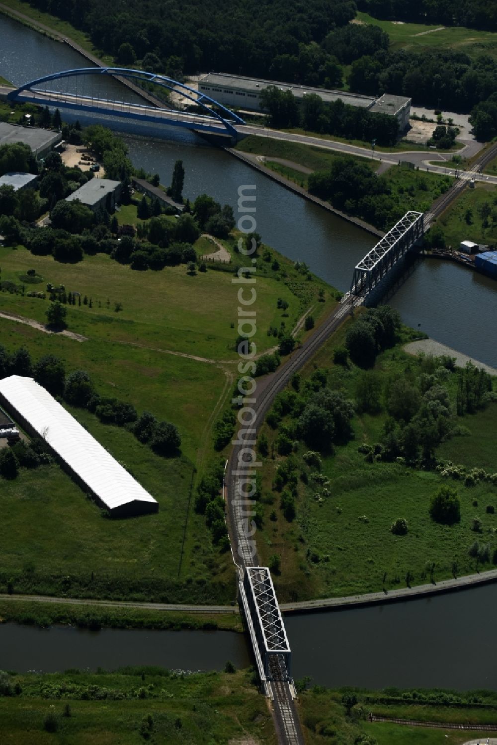 Genthin from above - Railway bridges and blue steel arc bridge with the federal road B1 across the Elbe-Havel-Canal in the Northeast of Genthin in the state of Saxony-Anhalt