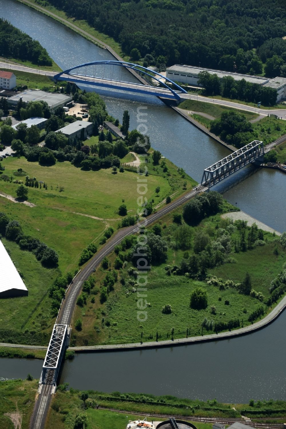 Aerial image Genthin - Railway bridges and blue steel arc bridge with the federal road B1 across the Elbe-Havel-Canal in the Northeast of Genthin in the state of Saxony-Anhalt