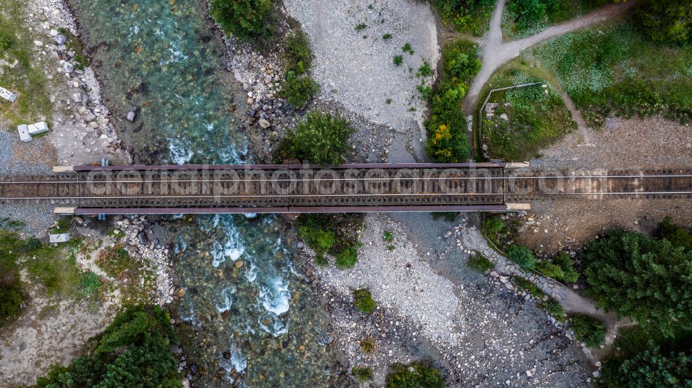 Lake Louise from the bird's eye view: Railway bridge building to route the train tracks across Bow River on street Village Road in Lake Louise in Alberta, Canada