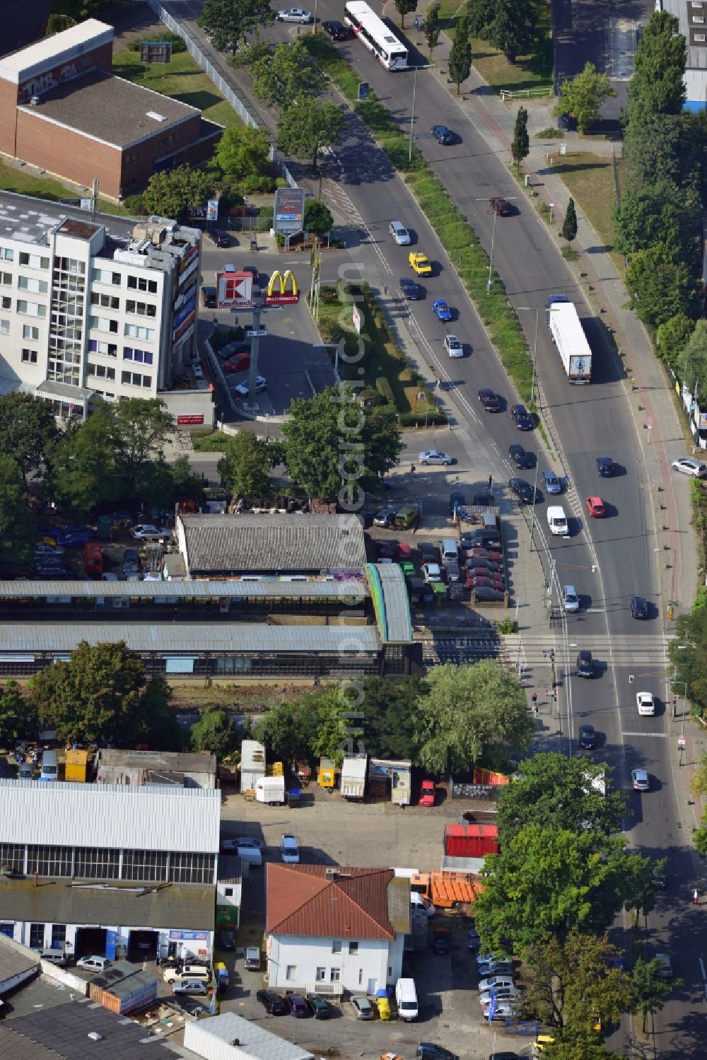 Berlin from the bird's eye view: Crossing Buckower Chaussee at the railway line Dresdner Bahn to the same S-Bahn station in Berlin