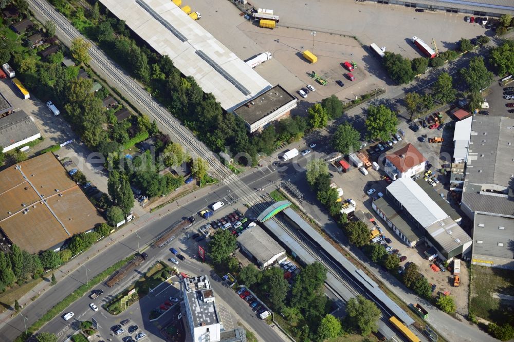 Berlin from the bird's eye view: Crossing Buckower Chaussee at the railway line Dresdner Bahn to the same S-Bahn station in Berlin