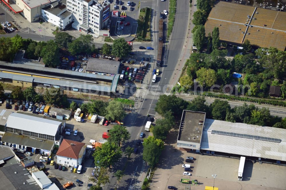 Berlin from the bird's eye view: Crossing Buckower Chaussee at the railway line Dresdner Bahn to the same S-Bahn station in Berlin