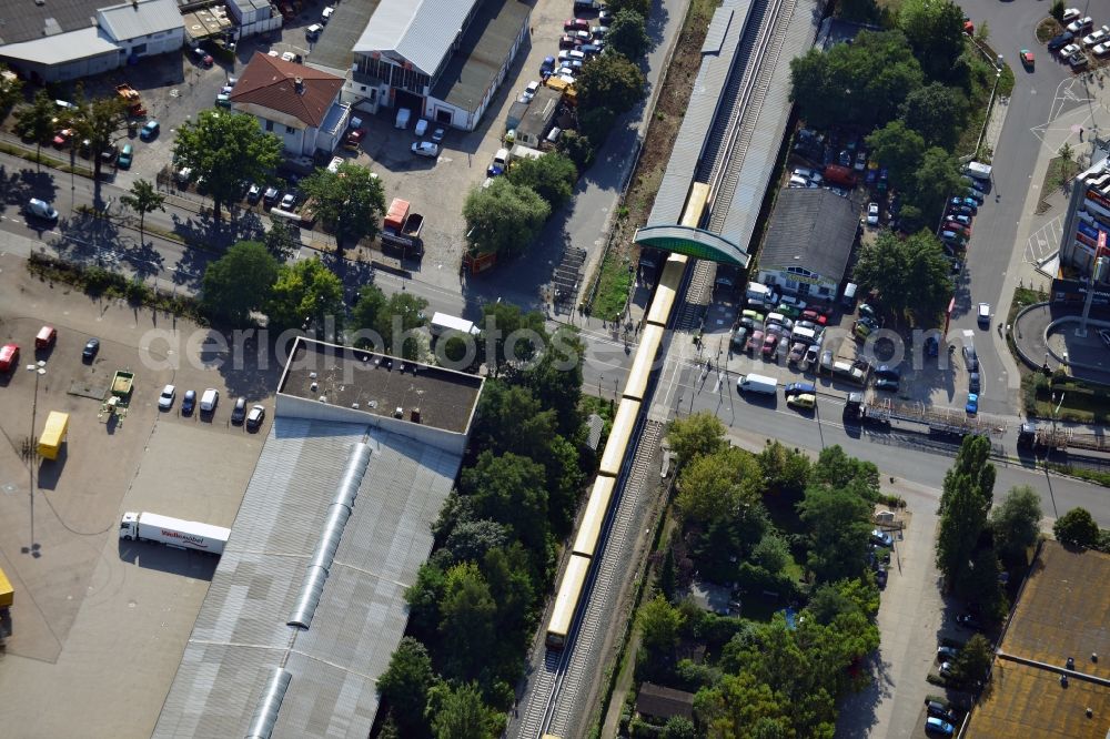 Aerial image Berlin - Crossing Buckower Chaussee at the railway line Dresdner Bahn to the same S-Bahn station in Berlin