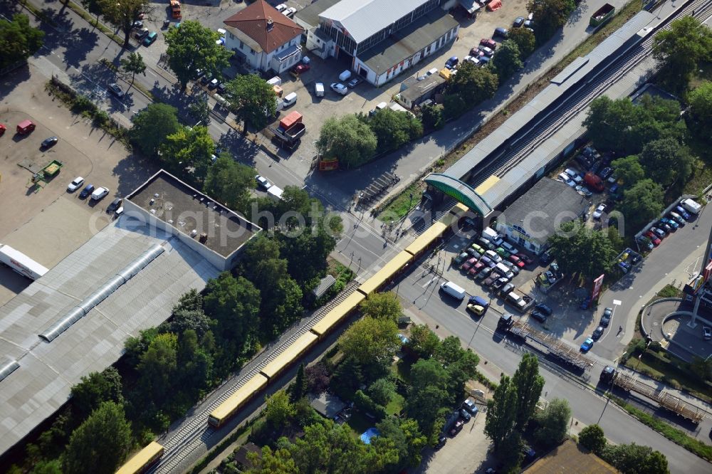 Aerial photograph Berlin - Crossing Buckower Chaussee at the railway line Dresdner Bahn to the same S-Bahn station in Berlin