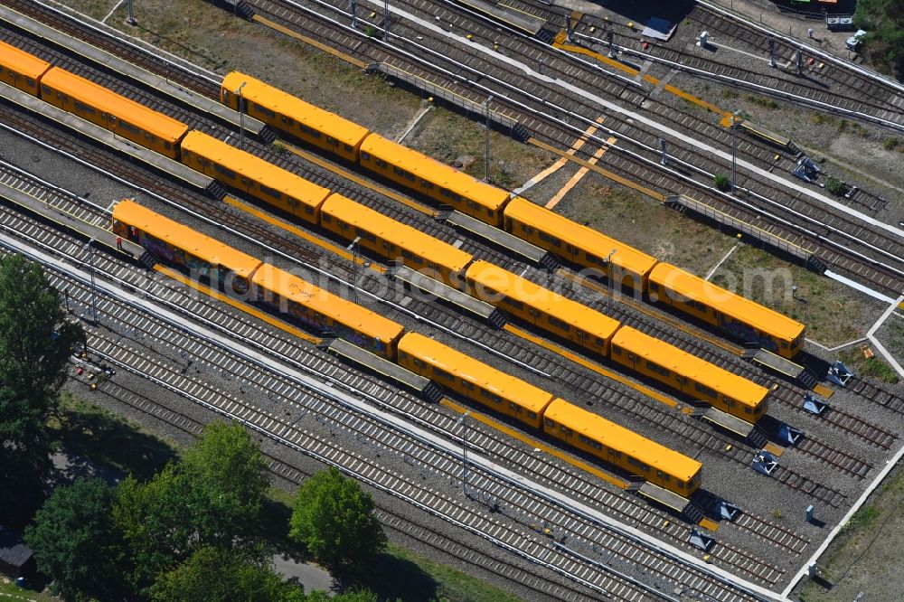 Berlin from above - Railway depot and repair shop for maintenance and repair of trains of passenger transport of the series of U-Bahn - Betriebswerkstatt BVG on Schlosserweg in the district Neukoelln in Berlin, Germany