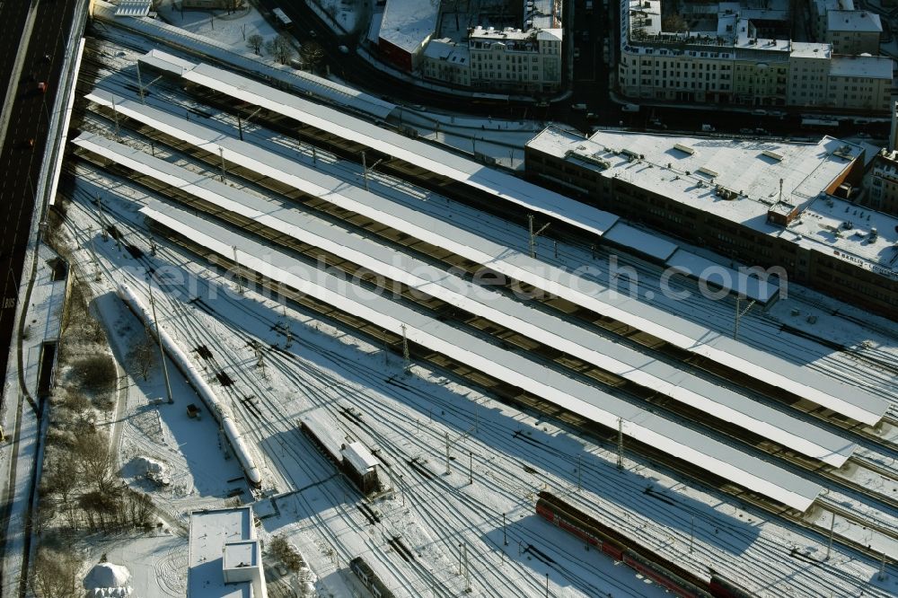 Aerial image Berlin - Wintry snowy terrain railway depot and repair shop for maintenance and repair of trains of passenger transport destrict Lichtenberg in Berlin in Germany