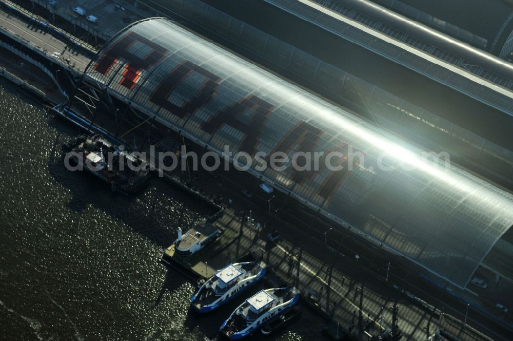 Amsterdam from above - View of the newly constructed glass roof of the bus stop at the station Amsterdam Centraal at the Open Havenfront in Amsterdam in the province of North Holland in the Netherlands