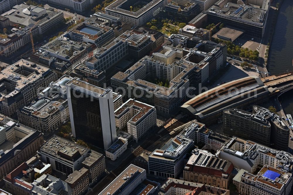 Berlin from above - Station building and track systems of the S-Bahn station Friedrichsstrasse in Berlin in Germany. The station is located next to the Spreedreieck area with office highrises and the International Trade Center IHZ