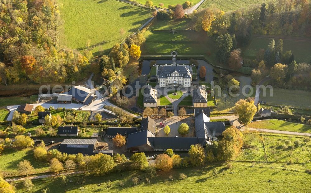 Rüthen from the bird's eye view: View of baroque moated castle Koertlinghausen surrounded by autumnal coloured trees near Ruethen in the Sauerland region of the state North Rhine-Westphalia