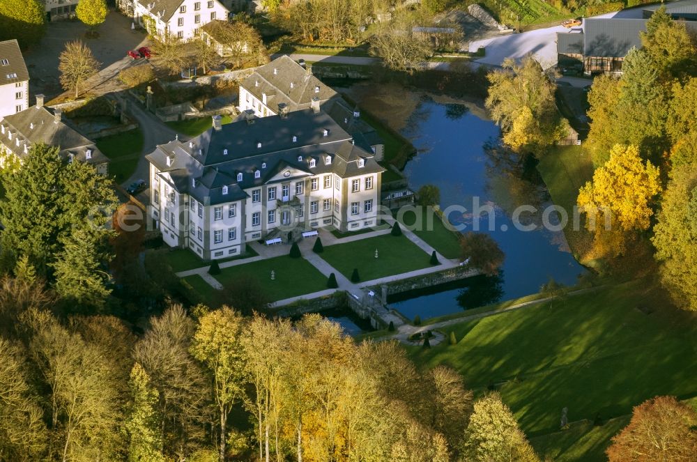 Rüthen from above - View of baroque moated castle Koertlinghausen surrounded by autumnal coloured trees near Ruethen in the Sauerland region of the state North Rhine-Westphalia