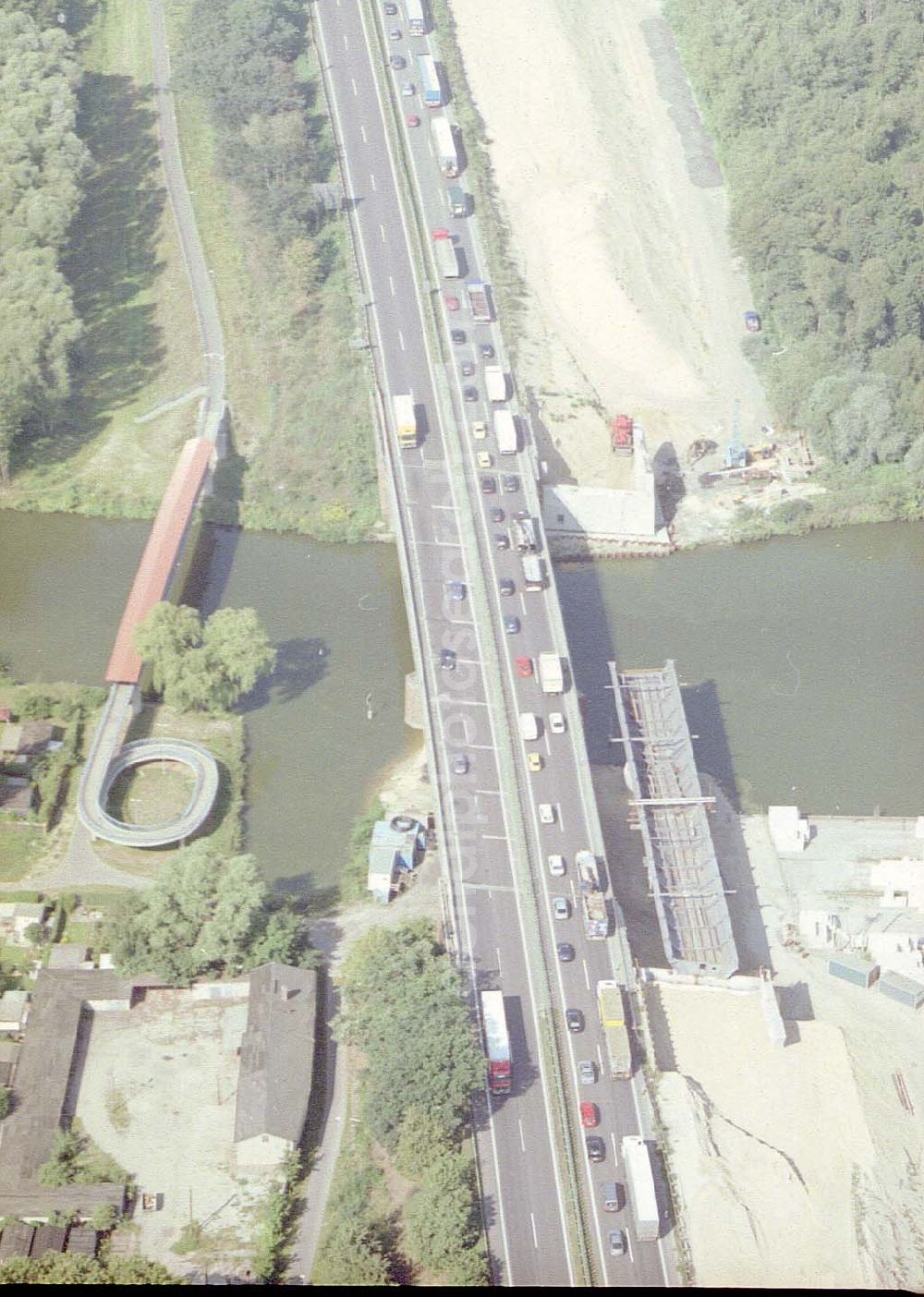 Königs Wusterhausen from the bird's eye view: Bau der Autobahnbrücke (A10) über die Dahme in Königs Wusterhausen - ein Projekt der SCHÄLERBAU BERLIN GmbH.