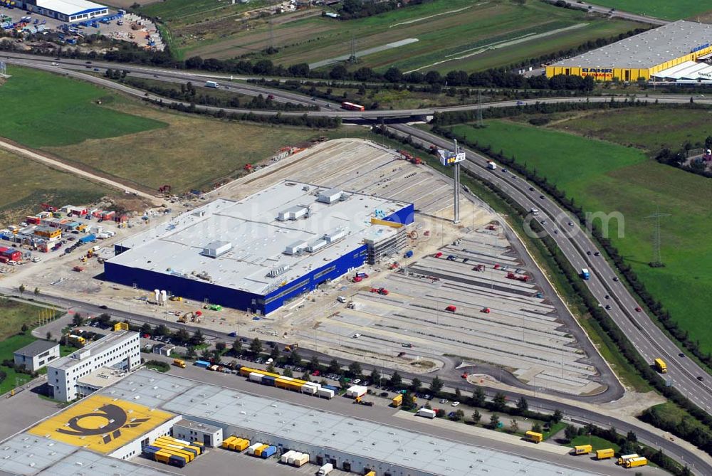 Aerial photograph Augsburg - Bau des IKEA Einrichtungshauses Augsburg.Gebaut wird die IKEA Filiale in Augsburg auf einer Grundstücksfläche von 80.000 Quadratmetern mit einer Bruttogeschossfläche von 29.000 Quadratmetern. Für die Kunden werden auf dem Gelände 1.440 Parkplätze zur Verfügung stehen. Die Investitionskosten in das neue IKEA Haus betragen ca. 46 Mio. Euro. Begonnen wurde mit den Bauarbeiten im April 2006, und sie verlaufen planmäßig. Am Schnittpunkt der Autobahn A8 München-Stuttgart