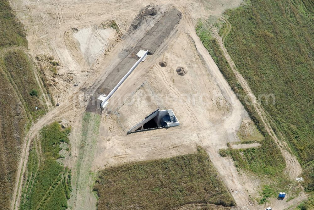 Schönefeld from above - Bau der Trogbaugrube am Flughafen Schönefeld, BBI. Die Trogbauwerke in offener Bauweise, dienen dem Ausbau des Schienennetzes der Deutschen Bahn AG am BBI- Flughafen. Bauherr ist DB Netz. Construction of the trough excavation at the airport Schönefeld BBI. The excavation in open cut, are used to expand the rail network of Deutsche Bahn AG on BBI airport. Building owner is the DB network.