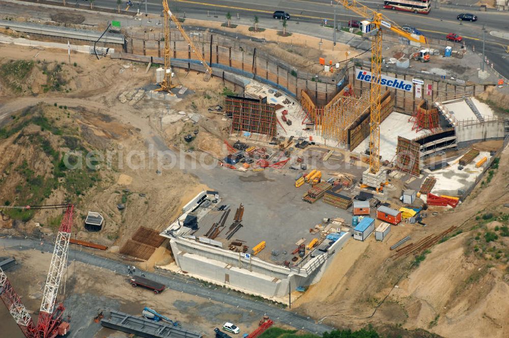 Dresden from the bird's eye view: Blick auf die im Bau befindliche Waldschlösschenbrücke über die Elbe in Dresden mit den Stahlträgern der belgischen Firma Victor Buyck Steel Constructions nach Vorgaben des Büros AWB Architekten Architekturbüro Bauer BDA und Bauleistungen der EUROVIA Beton GmbH. View the construction site of Waldschlösschen bridge over the Elbe in Dresden / Saxony.