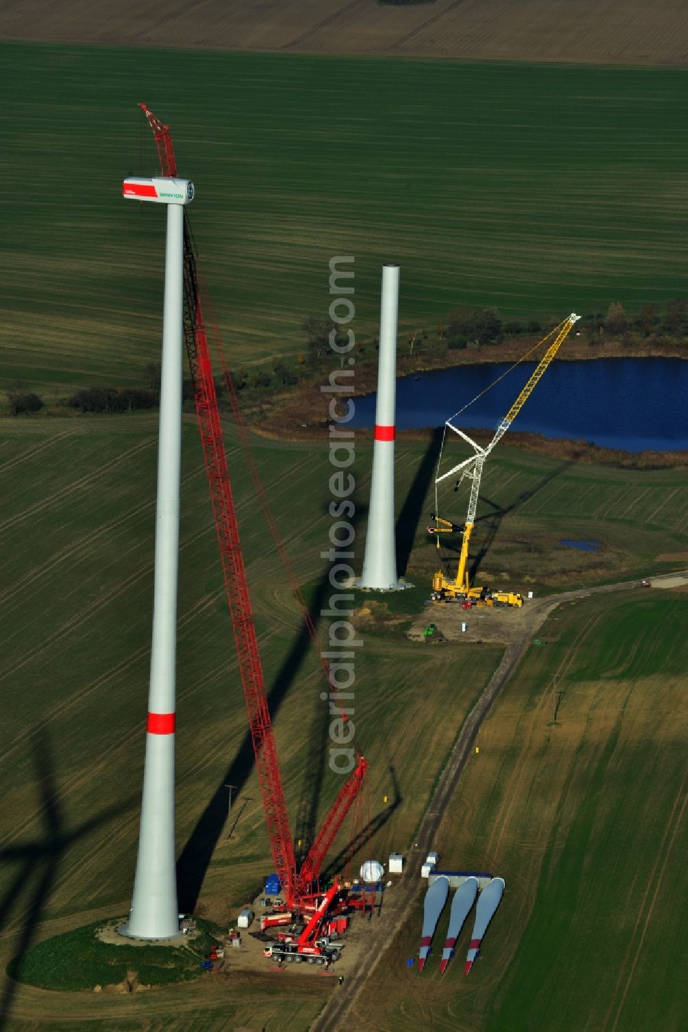 Prenzlau from above - Construction of a wind turbine of company Senvion in Prenzlau in the state of Brandenburg. In the background lying the rotor blades