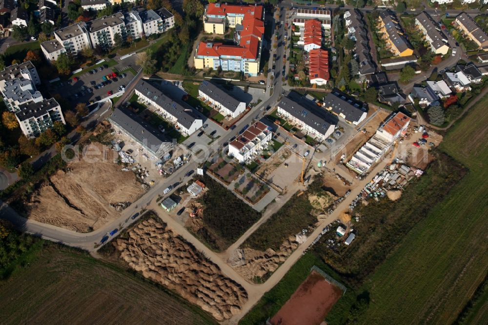 Aerial image Mainz - Construction works on a new residential area in Mainz in the state of Rhineland-Palatinate. The construction site is located amidst residential buildings and agricultural land in the Kurmainz Street in the Finthen part of Mainz